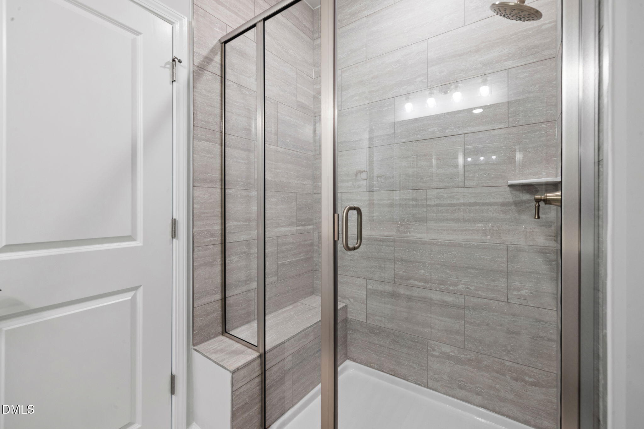 348 Broomside Avenue Raleigh, NC 27603 - Photo 16 of 33 a bathroom with a glass shower door