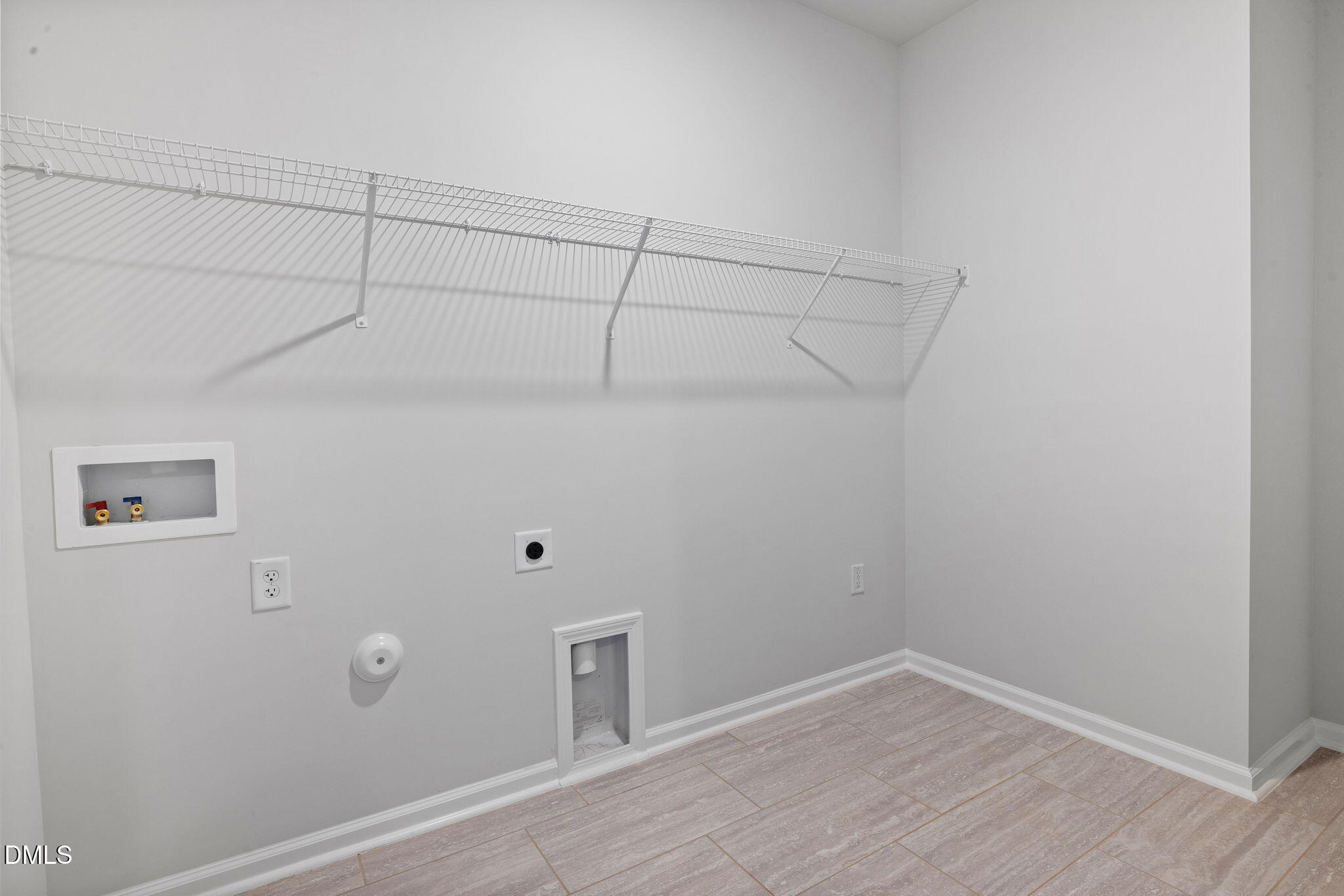 348 Broomside Avenue Raleigh, NC 27603 - Photo 21 of 33 a view of a room with racks on the wall