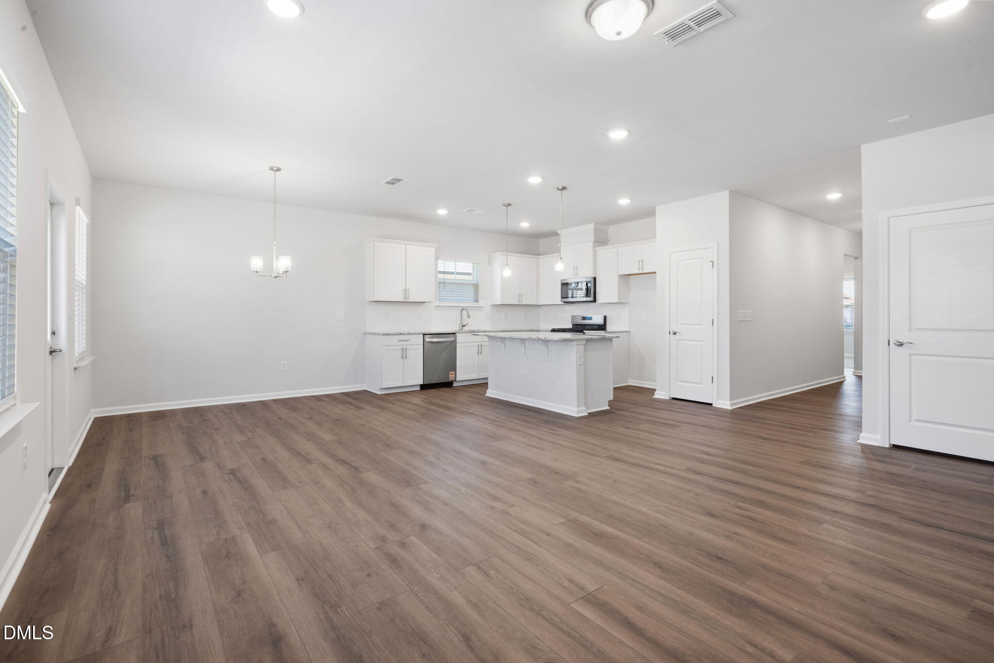 348 Broomside Avenue Raleigh, NC 27603 - Photo 4 of 33 a view of kitchen with wooden floor