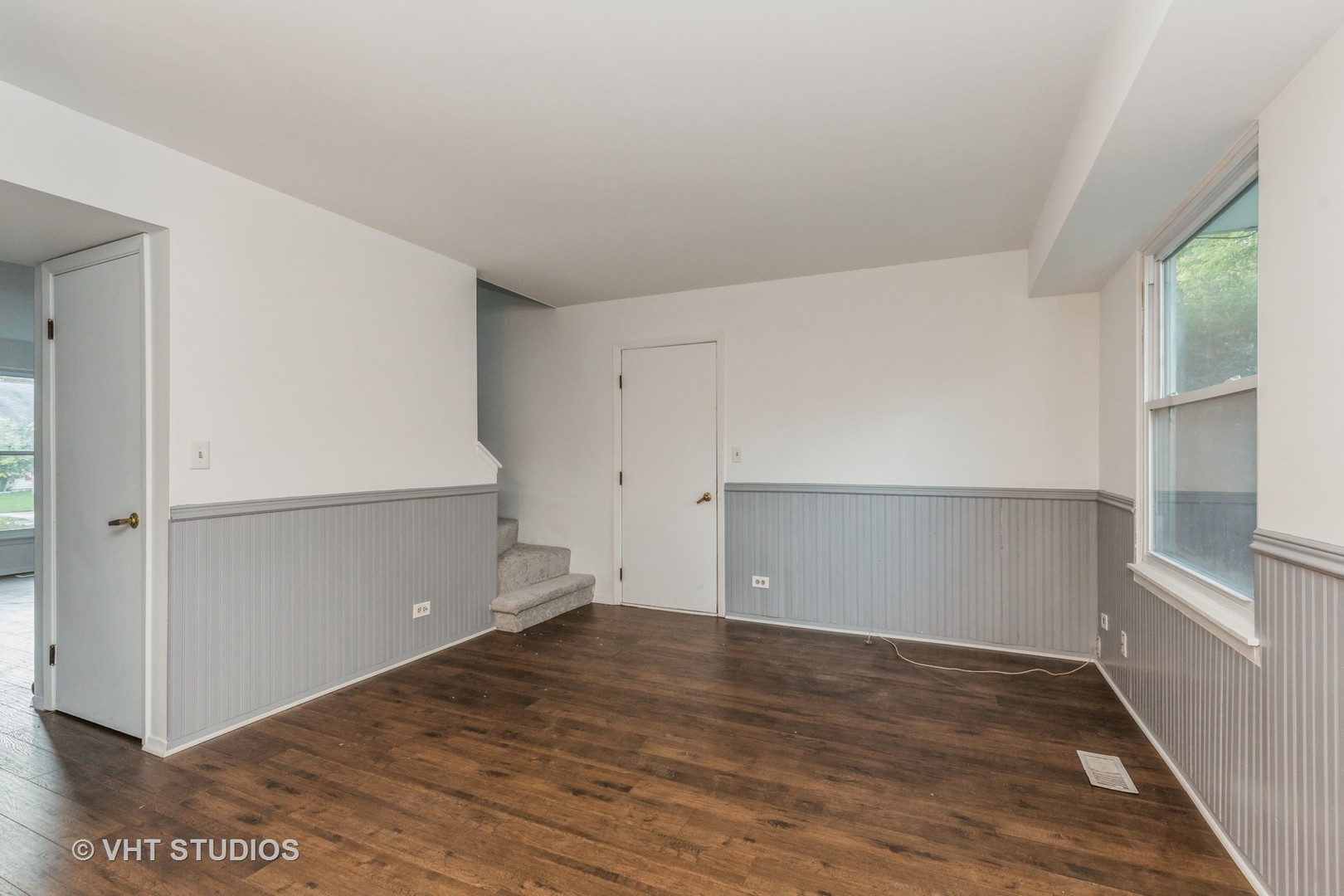 1050 Perry Drive Algonquin, IL 60102 - Photo 7 of 11 an empty room with wooden floor and cabinet