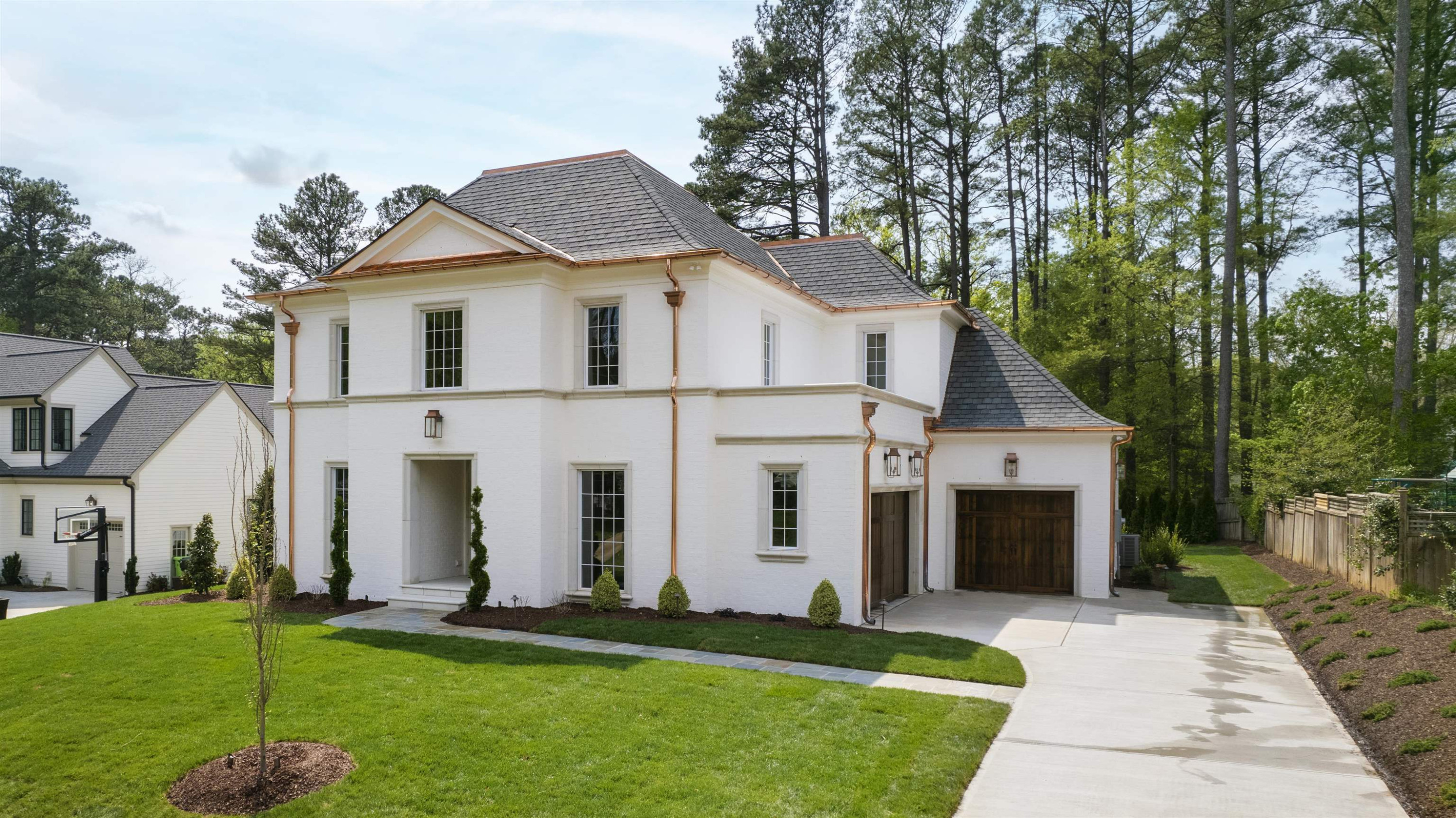 4813 Rampart Street Raleigh, NC 27609 - Photo 2 of 7 a front view of a house with a yard