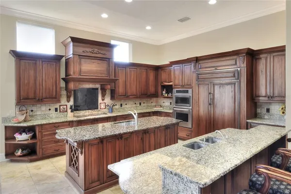 a kitchen with a refrigerator and a sink
