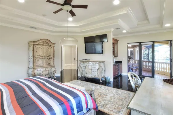 a bed sitting in a bedroom next to a window