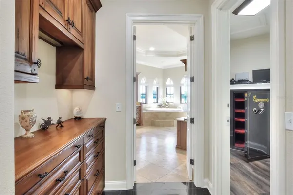 a bedroom with a bed mirror and a window