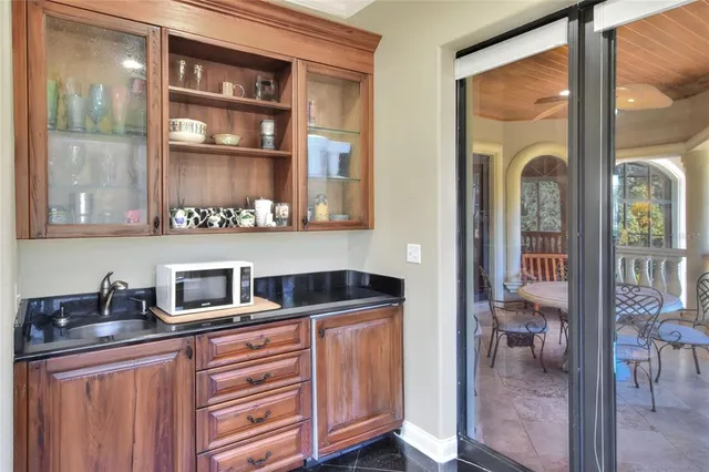 a view of kitchen with oven and cabinets