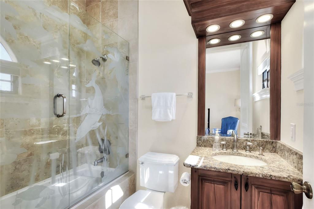 4215 Sb Merrion Road Lakeland, FL 33810 - Photo 59 of 95 a bathroom with a granite countertop sink a toilet and shower