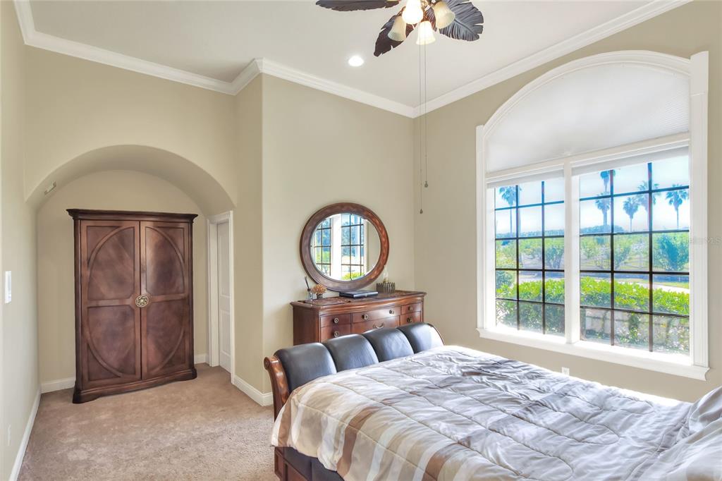 4215 Sb Merrion Road Lakeland, FL 33810 - Photo 69 of 95 a bedroom with a bed mirror and a window