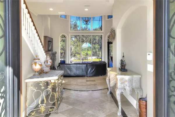 a large kitchen with kitchen island granite countertop a large counter top and stainless steel appliances
