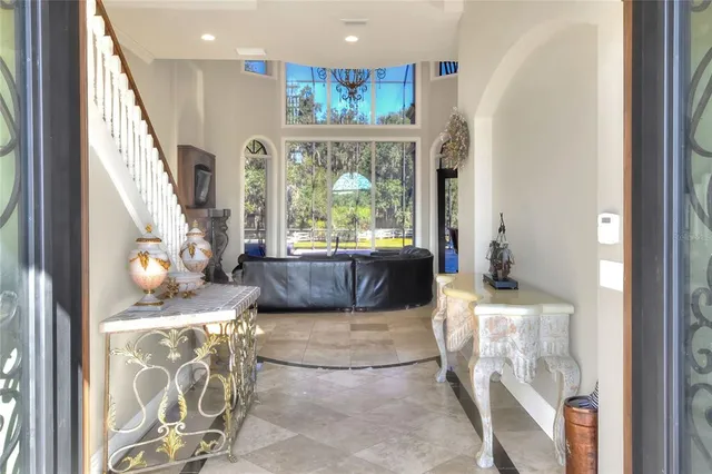 a large kitchen with kitchen island granite countertop a large counter top and stainless steel appliances