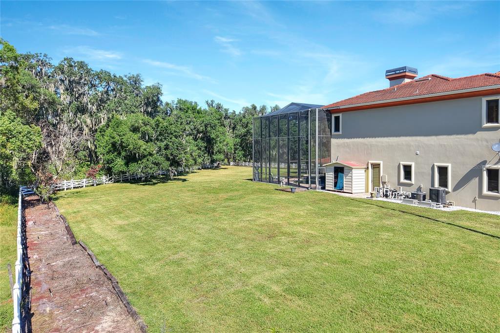 4215 Sb Merrion Road Lakeland, FL 33810 - Photo 80 of 95 a view of a house with a yard