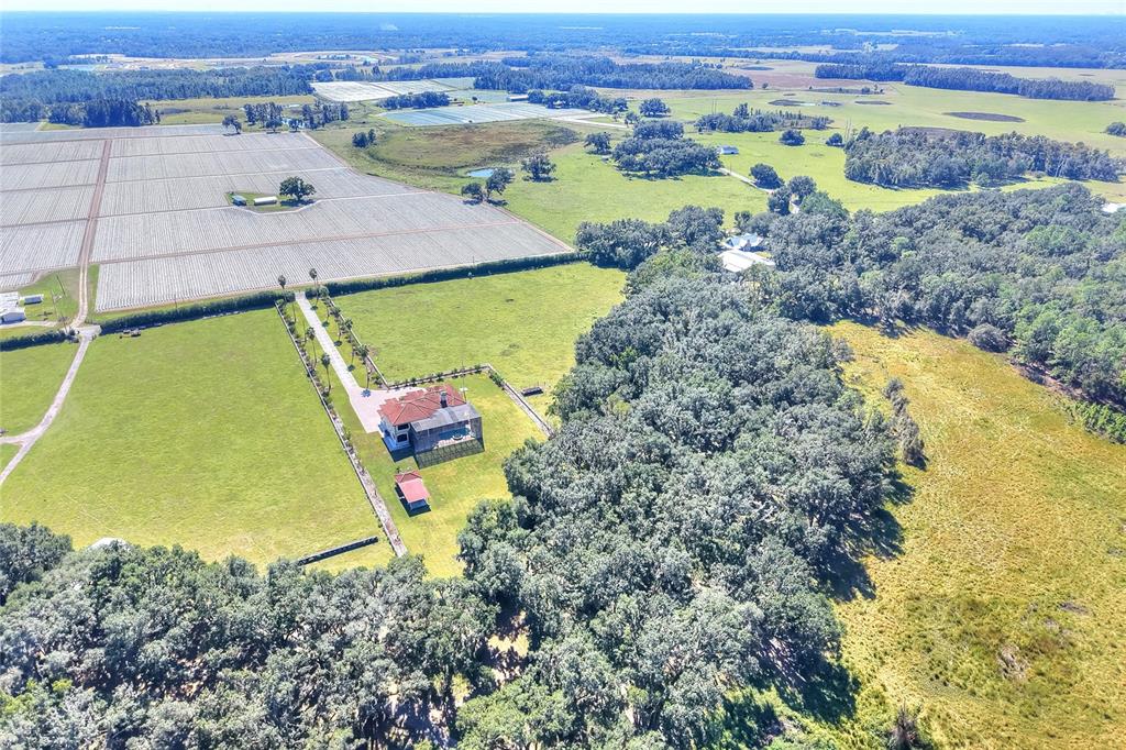 4215 Sb Merrion Road Lakeland, FL 33810 - Photo 92 of 95 an aerial view of a house with a yard and lake view