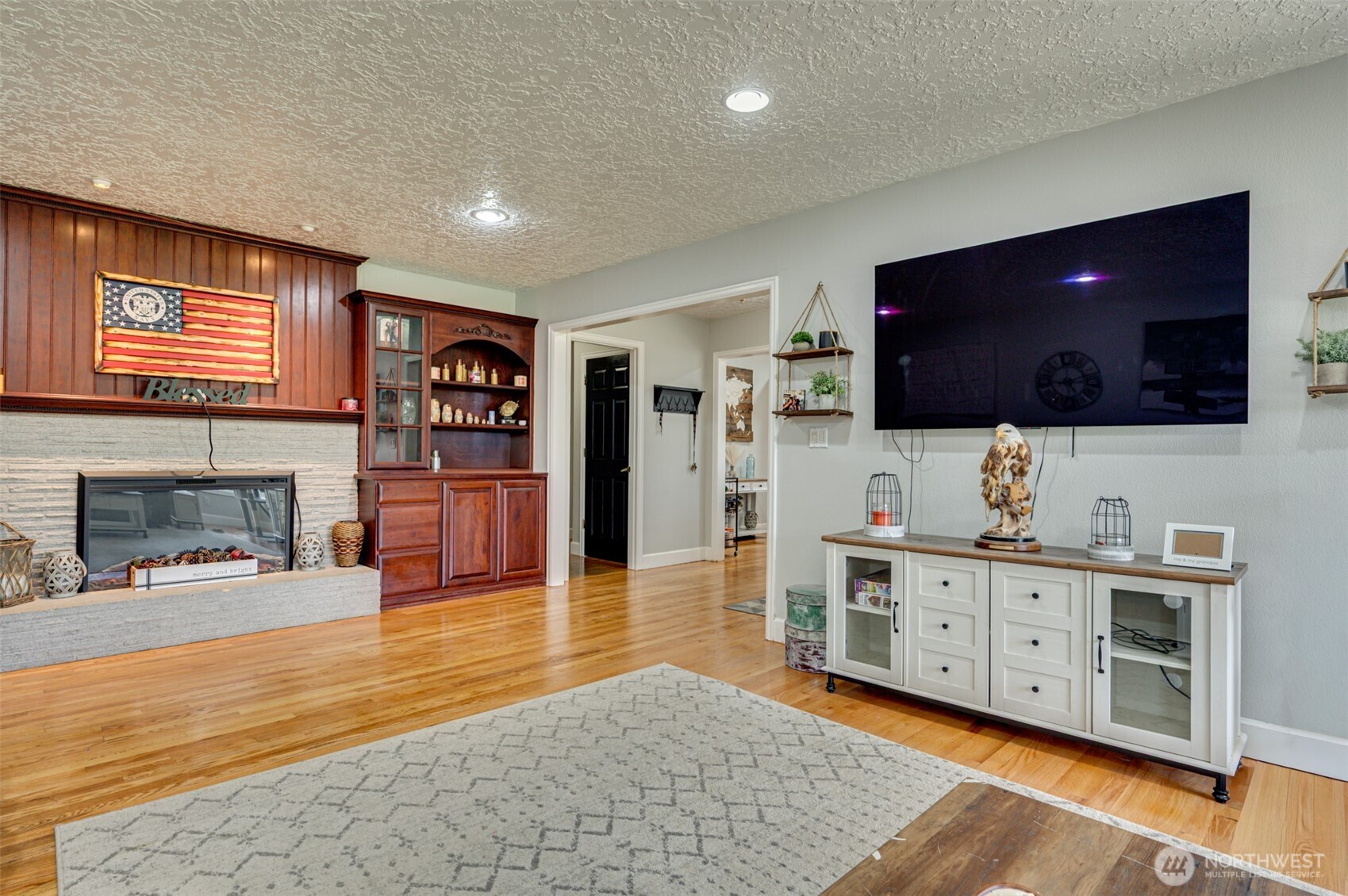 2126 Lewis River Road Woodland, WA 98674 - Photo 6 of 23 a living room with furniture and a flat screen tv