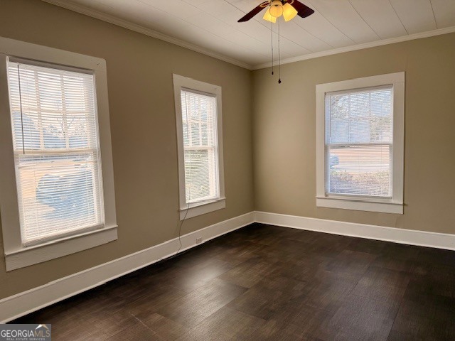 405 South Leroy Street Metter, GA 30439 - Photo 16 of 25 a view of an empty room with wooden floor and a window