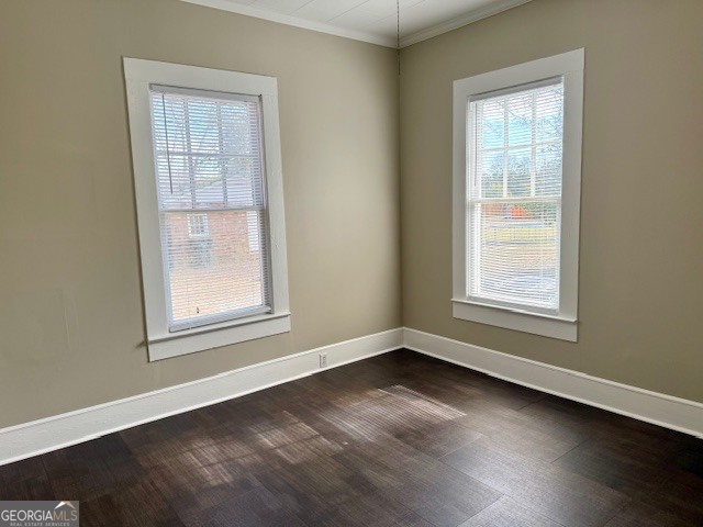 405 South Leroy Street Metter, GA 30439 - Photo 21 of 25 an empty room with wooden floor and windows