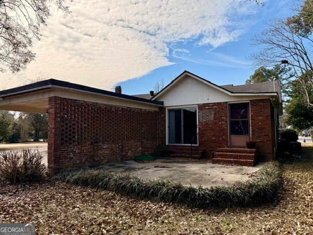 405 South Leroy Street Metter, GA 30439 - Photo 24 of 25 a front view of a house with garden