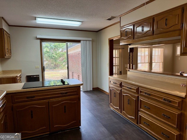 405 South Leroy Street Metter, GA 30439 - Photo 10 of 25 a kitchen with wooden cabinets and a stove top oven