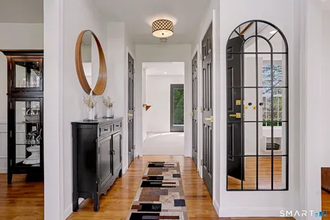 a view of a entryway door with wooden floor