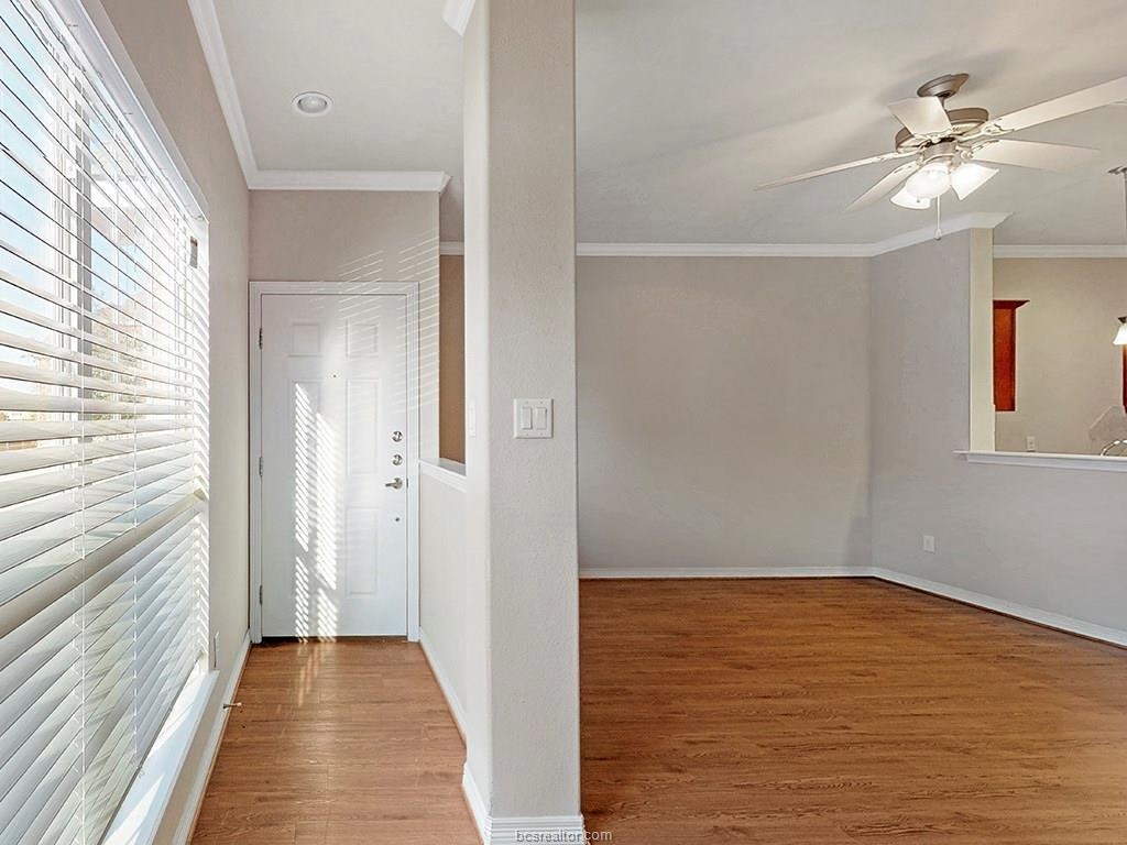 1198 Jones-Butler Road, Unit 2607 College Station, TX 77840 - Photo 16 of 26 a view of a room with wooden floor and fan