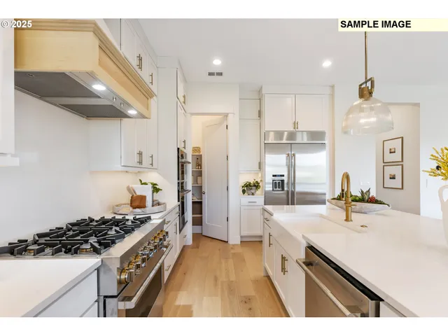 a kitchen with a sink stove and refrigerator