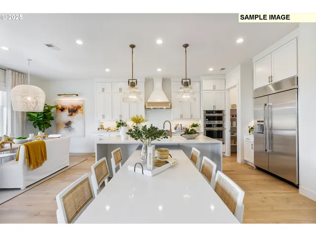 a living room with stainless steel appliances kitchen island granite countertop furniture