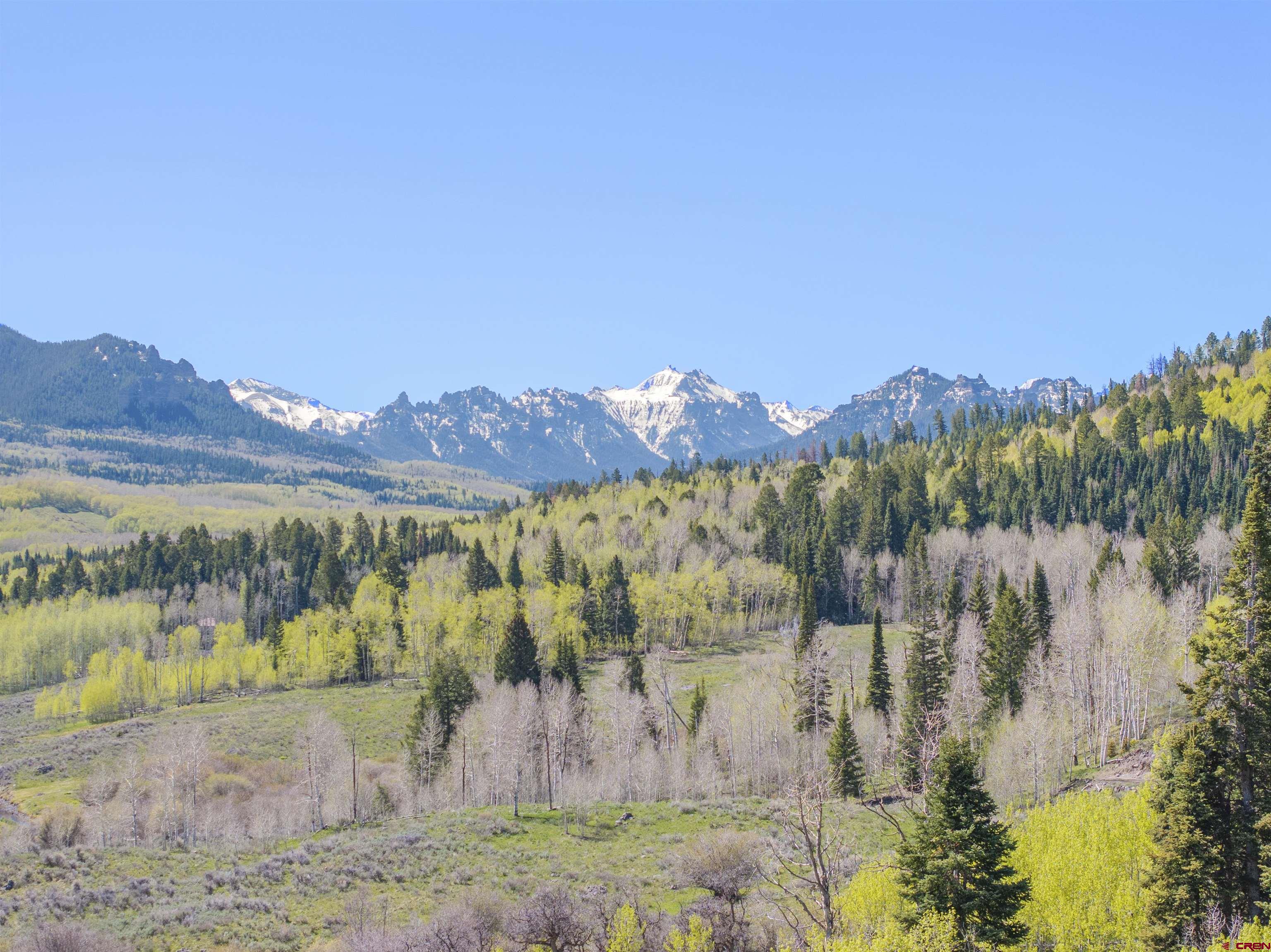 684 Falcon Way Montrose, CO 81403 - Photo 39 of 43 a view of a lake with a mountain in the background