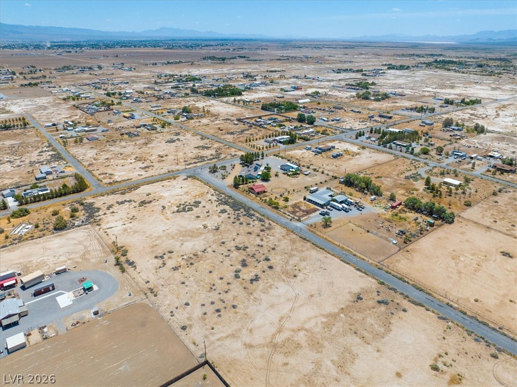 4610 Lawrence Road Pahrump, NV 89048 - Photo 38 of 42 Discover vast, undeveloped land ready for your vision in a serene, open landscape.