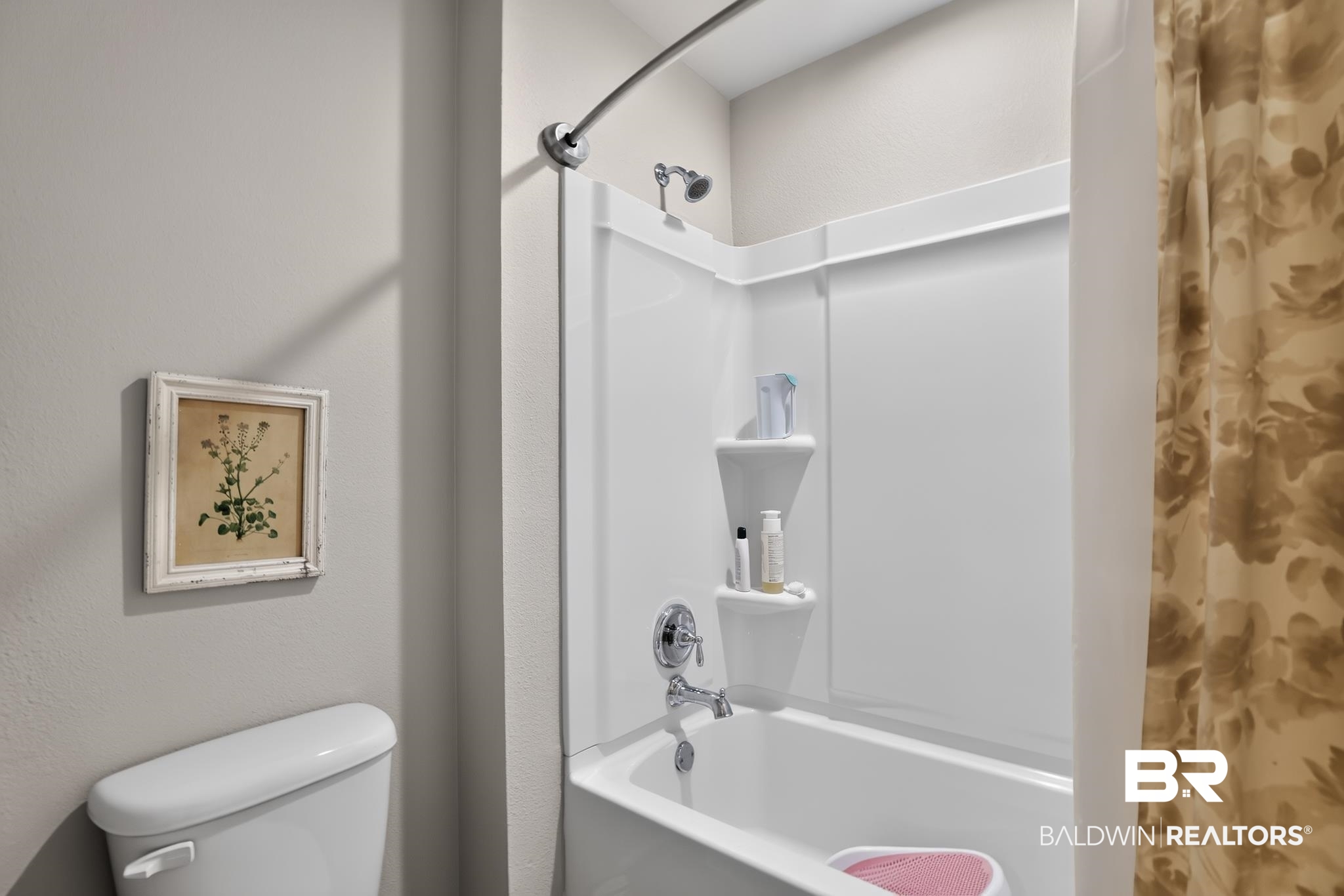 1210 Primrose Lane Foley, AL 36535 - Photo 19 of 33 Full-size bathtub with a white surround and integrated shelving