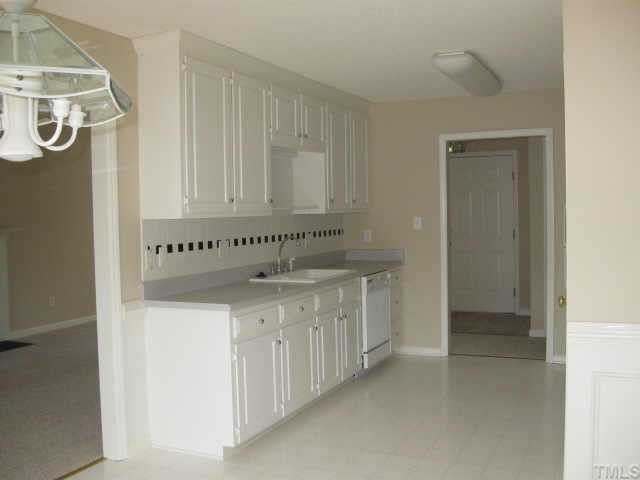 8104 Finland Drive Raleigh, NC 27612 - Photo 3 of 10 Kitchen features 42' cabinets and tiled backsplash. Other