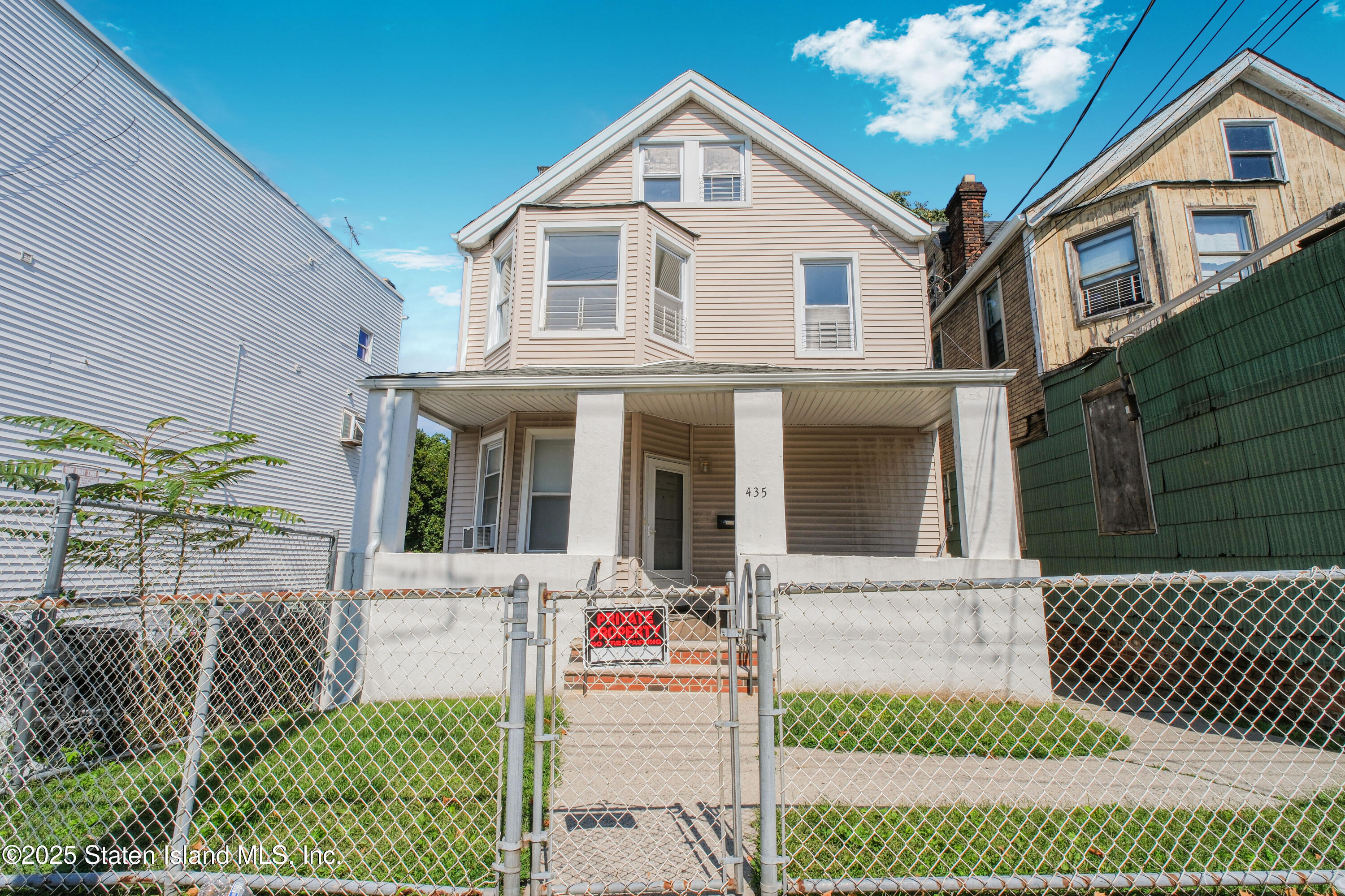 435 Castleton Avenue Staten Island, NY 10301 - Photo 1 of 47 a front view of a house with a porch