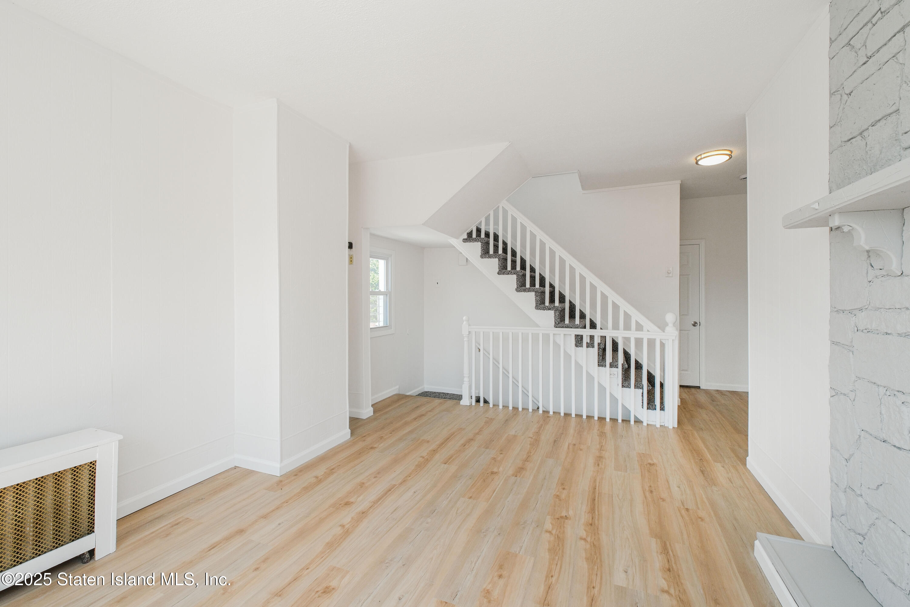 435 Castleton Avenue Staten Island, NY 10301 - Photo 11 of 47 a view of entryway with wooden floor