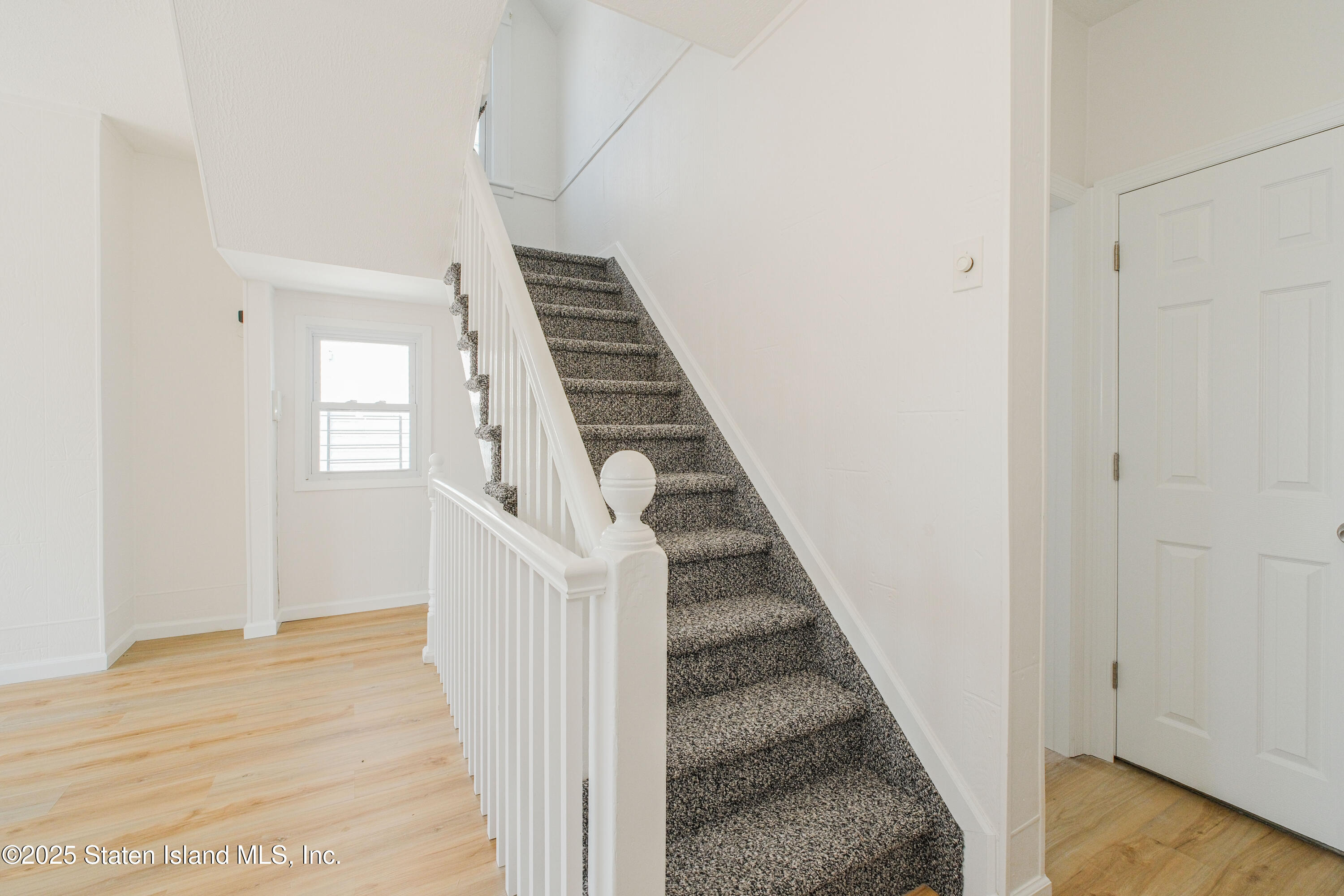 435 Castleton Avenue Staten Island, NY 10301 - Photo 23 of 47 a view of a hallway with wooden floor and entryway