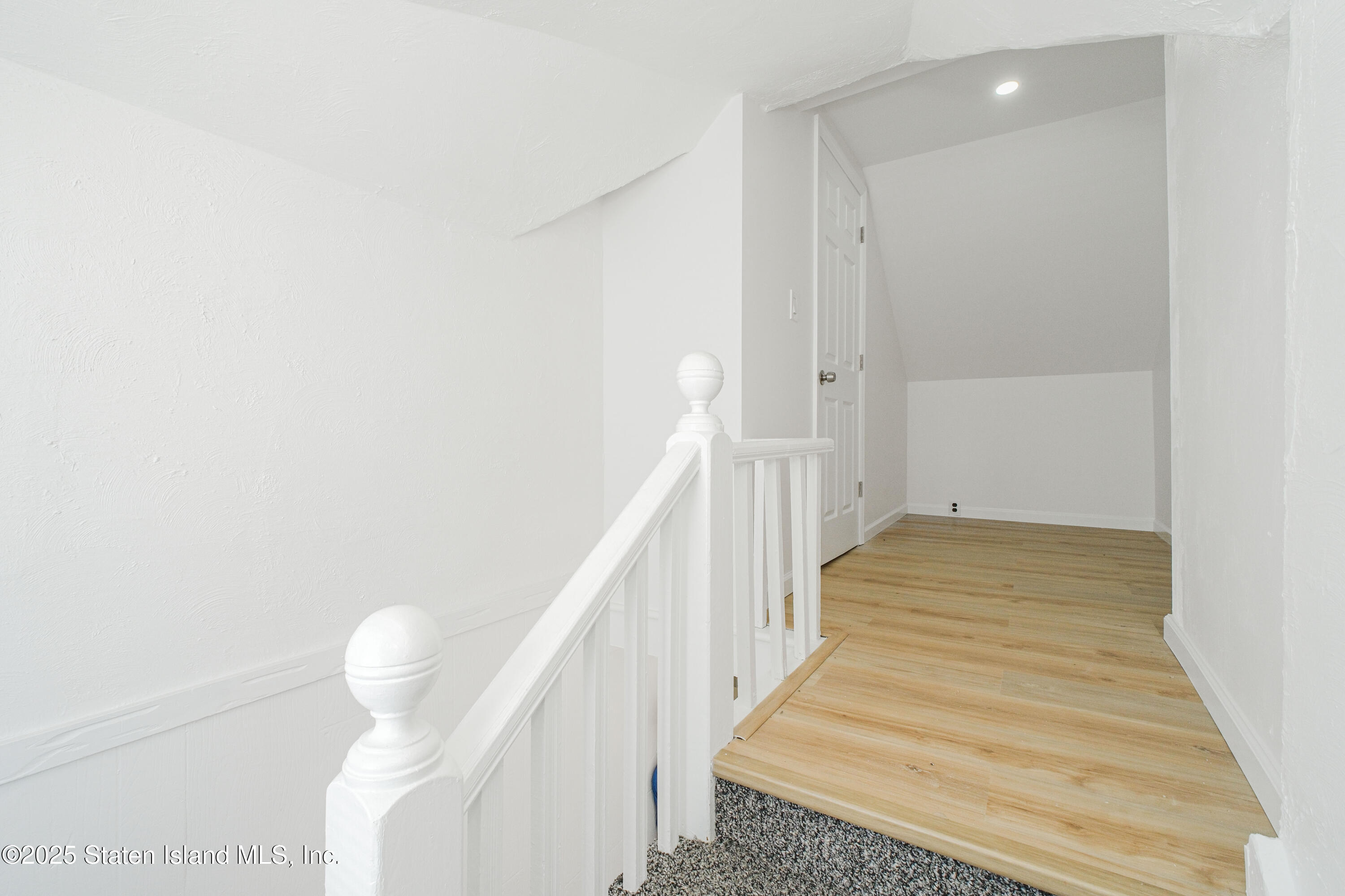 435 Castleton Avenue Staten Island, NY 10301 - Photo 30 of 47 a view of a hallway with wooden floor and staircase