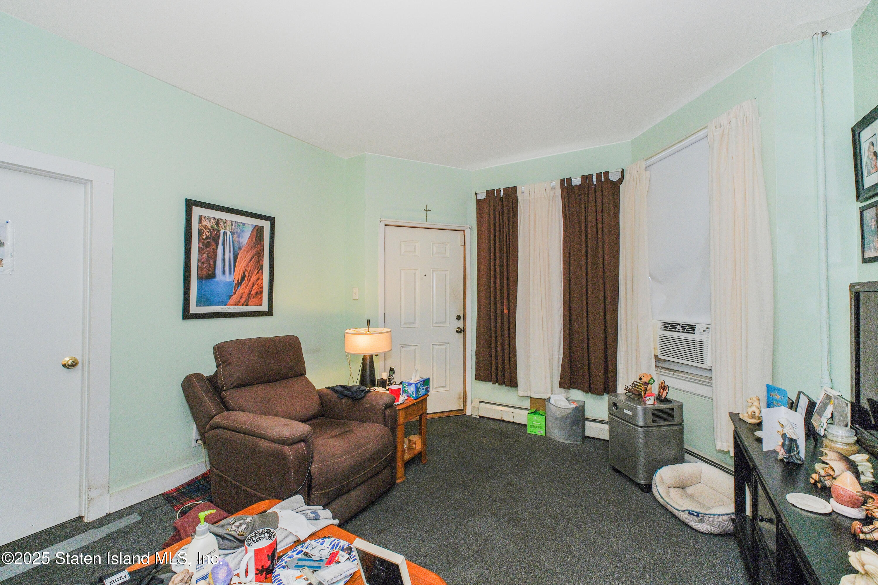435 Castleton Avenue Staten Island, NY 10301 - Photo 33 of 47 a living room with furniture and large window