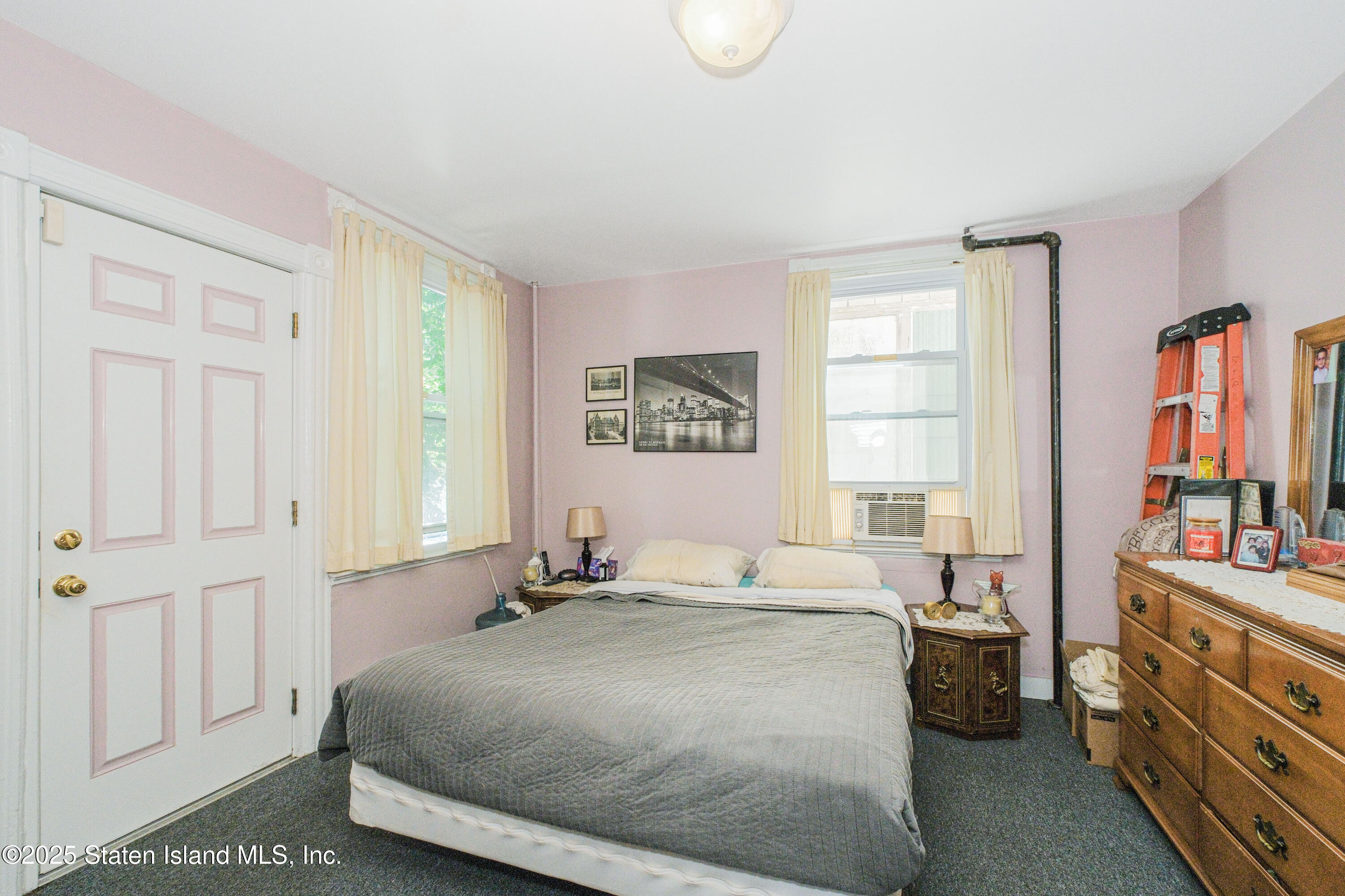 435 Castleton Avenue Staten Island, NY 10301 - Photo 34 of 47 a bedroom with a bed and a window
