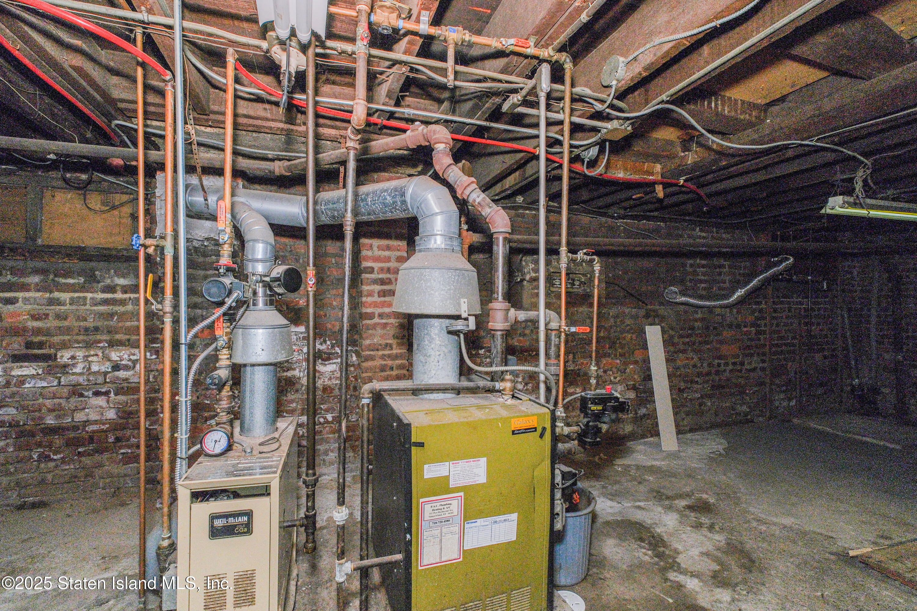 435 Castleton Avenue Staten Island, NY 10301 - Photo 45 of 47 a view of a storage room with washer and dryer
