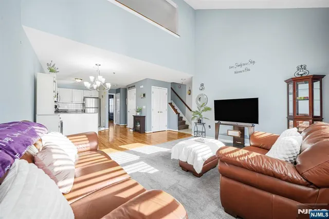 a bedroom with furniture and a flat screen tv