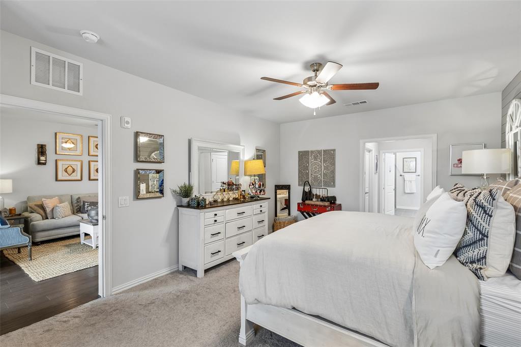 651 Watters Road, Unit 7204 Allen, TX 75013 - Photo 19 of 40 a bedroom with a bed and ceiling fan