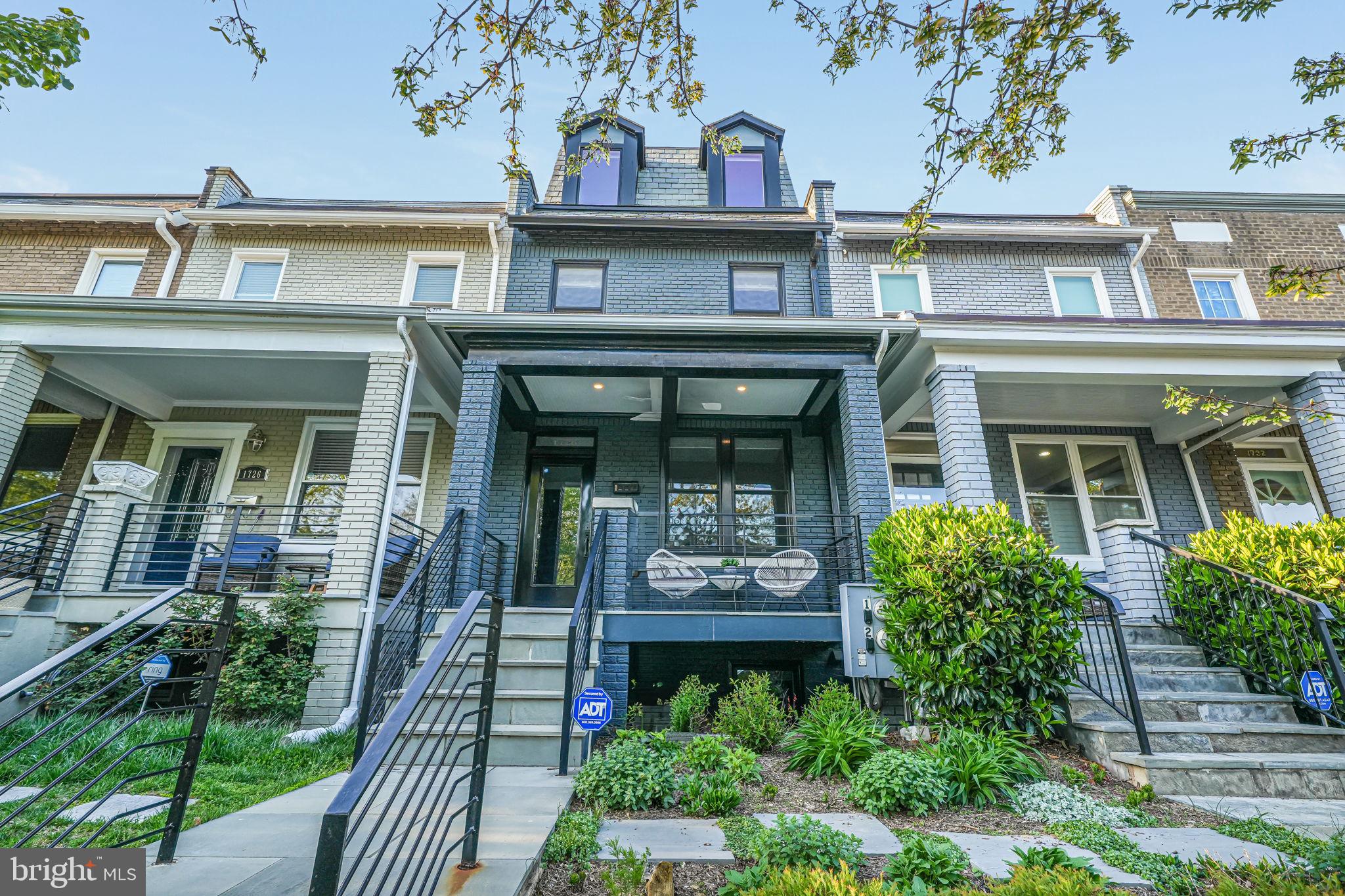 front view of a house with a small yard