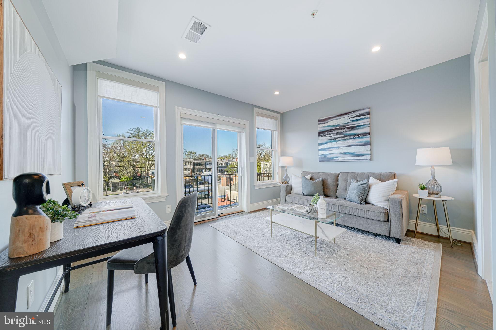 1728 D Street Southeast, Unit 2 Washington, DC 20003 - Photo 13 of 54 a living room with furniture and a large window