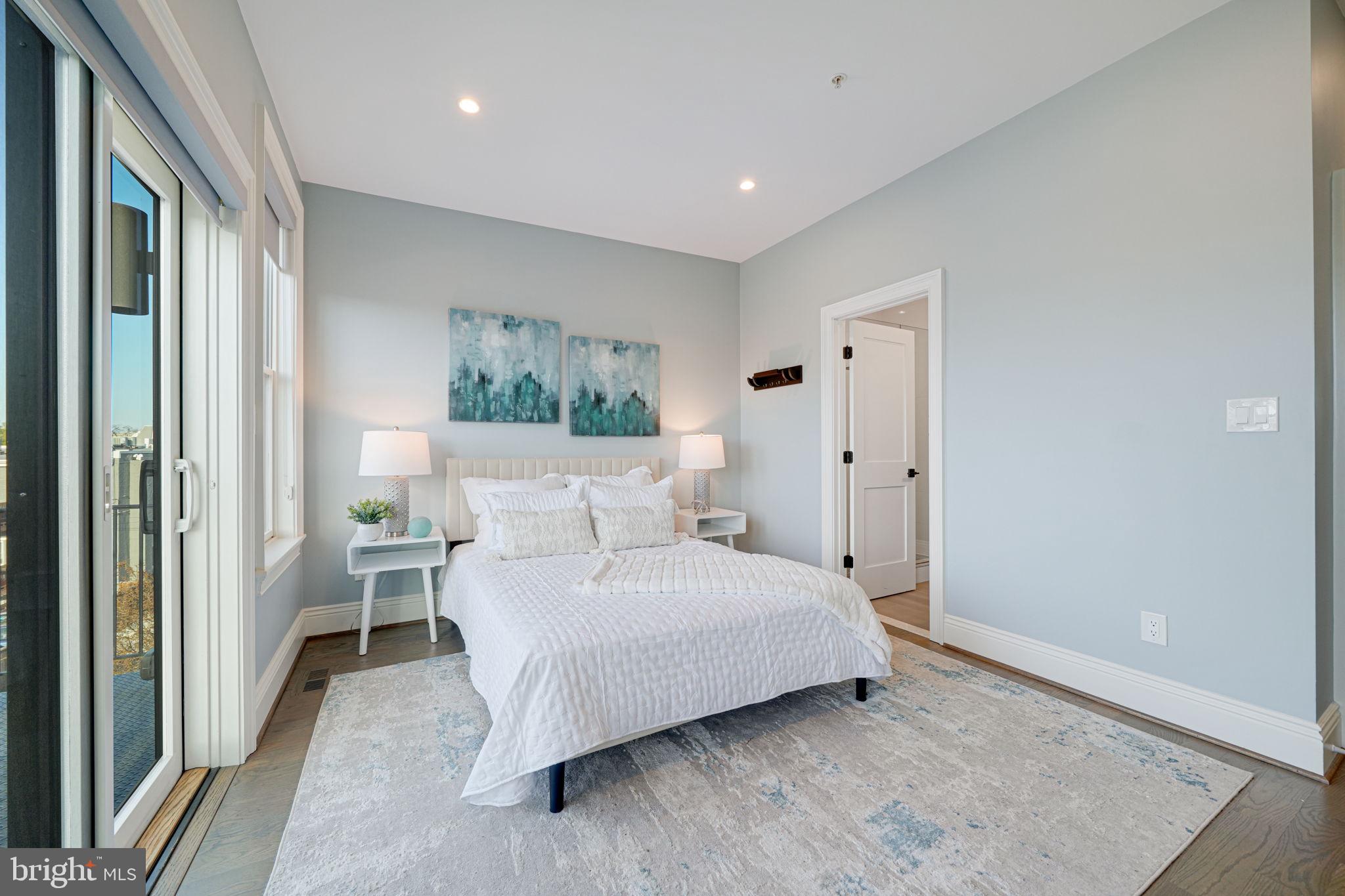 1728 D Street Southeast, Unit 2 Washington, DC 20003 - Photo 22 of 54 a bedroom with a bed and a couch