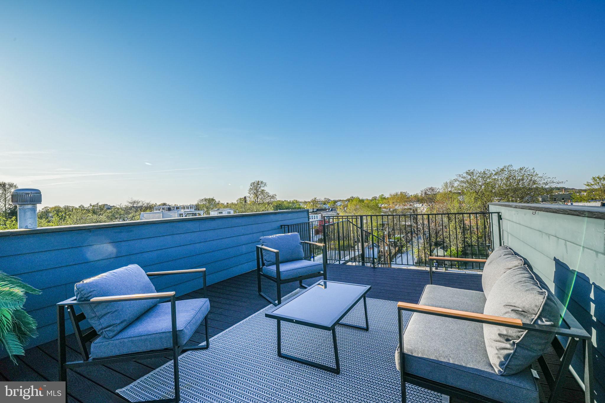 1728 D Street Southeast, Unit 2 Washington, DC 20003 - Photo 27 of 54 a view of a chairs and table on the terrace