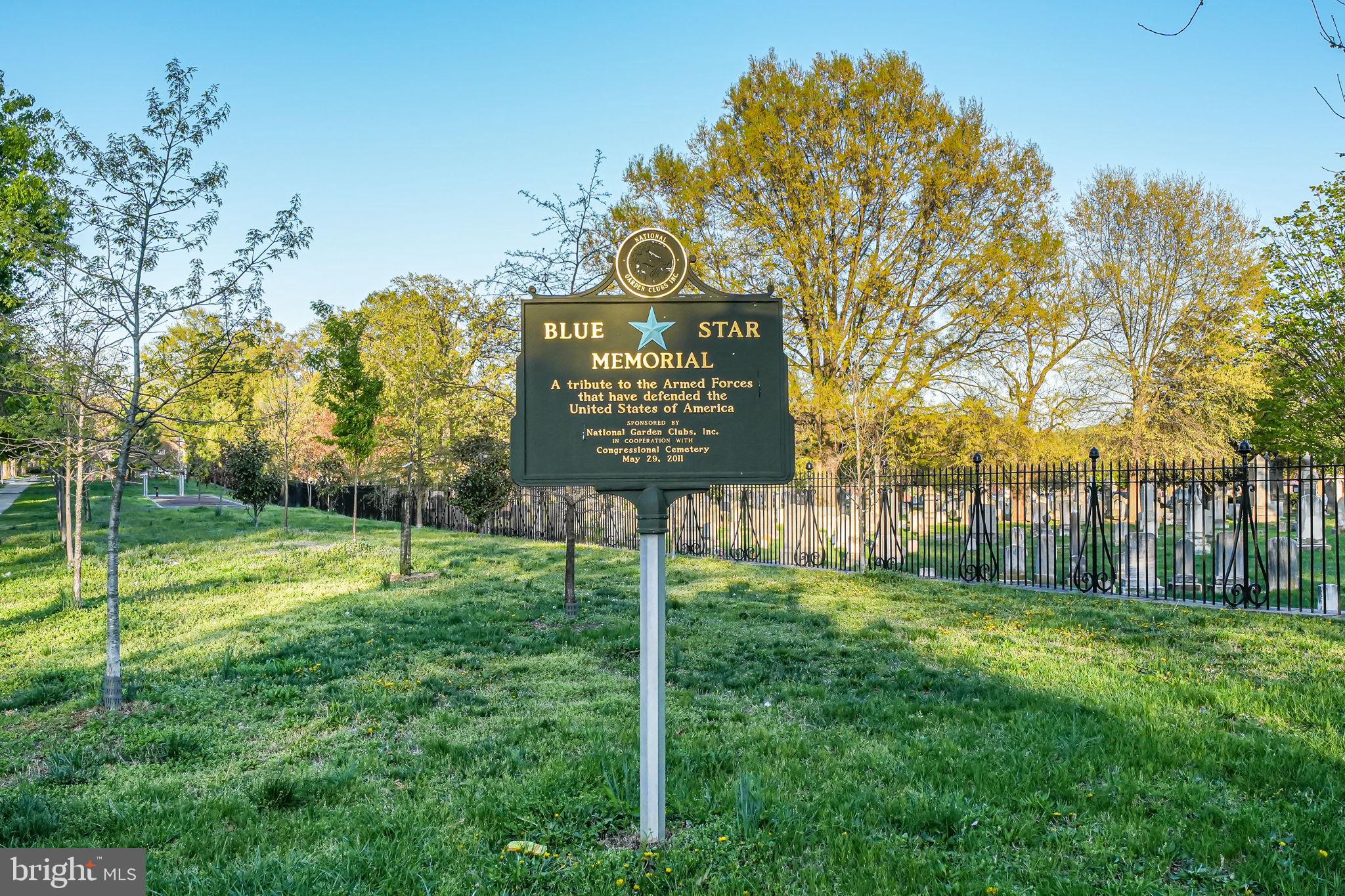 1728 D Street Southeast, Unit 2 Washington, DC 20003 - Photo 37 of 54 a view of a park that has a sign board large trees