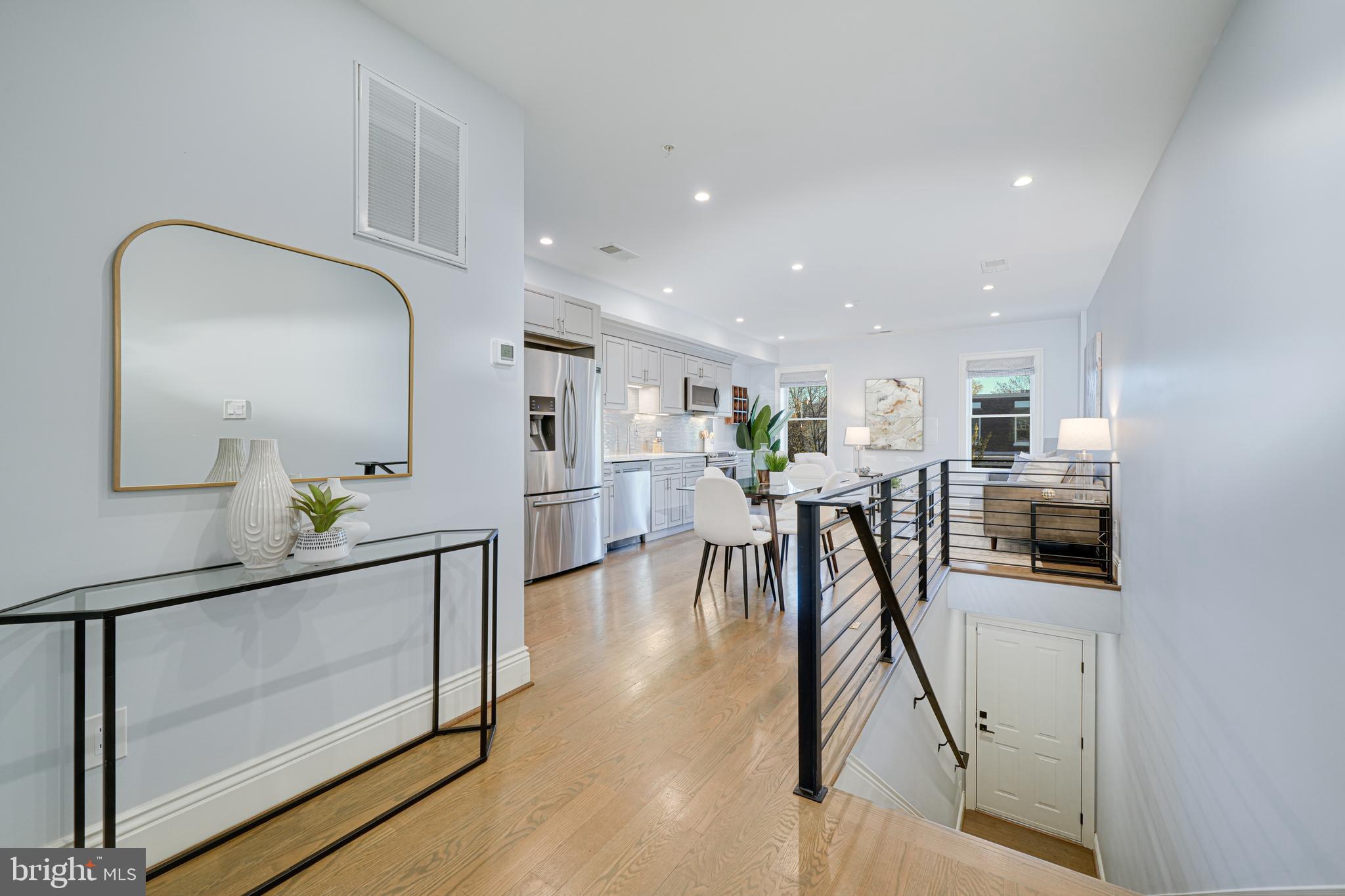 1728 D Street Southeast, Unit 2 Washington, DC 20003 - Photo 6 of 54 a view of a kitchen with furniture and a table