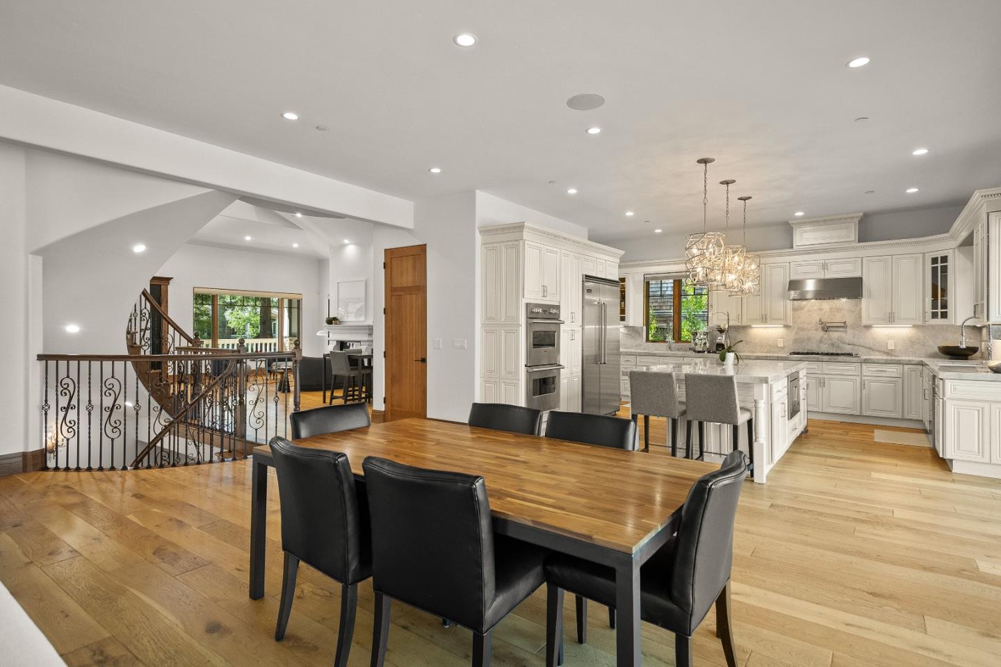 16362 Hilow Road Los Gatos, CA 95032 - Photo 13 of 55 a dining room with kitchen island a table and chairs