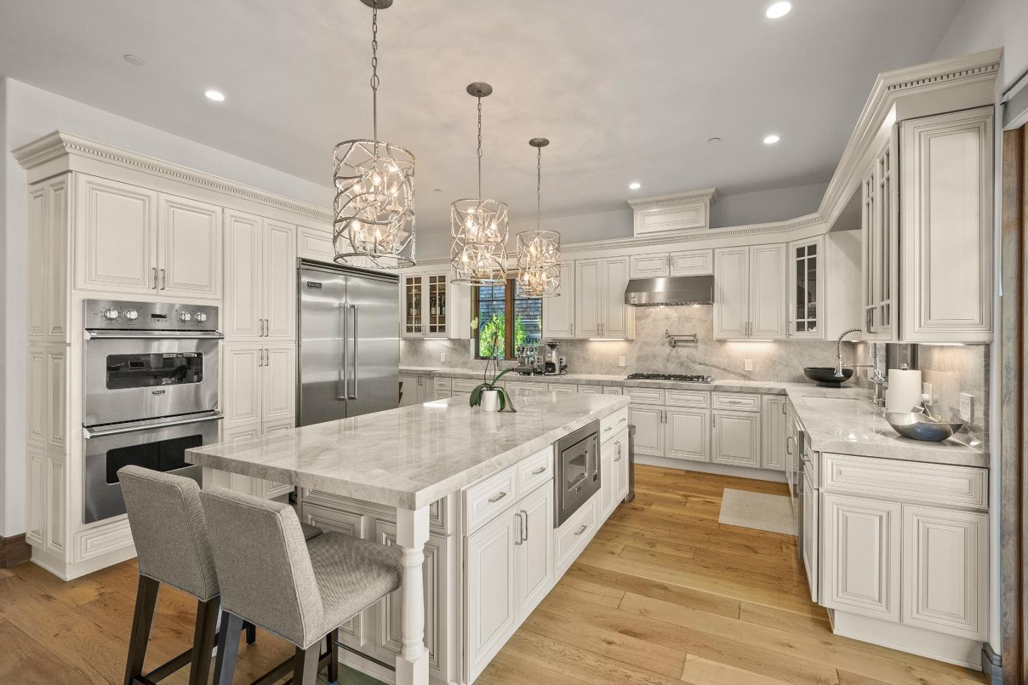 16362 Hilow Road Los Gatos, CA 95032 - Photo 14 of 55 a kitchen with stainless steel appliances granite countertop a kitchen island hardwood floor and a sink