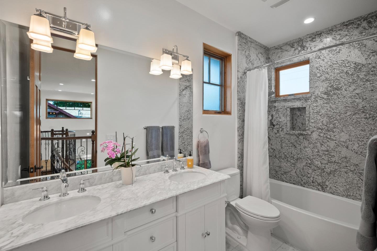 16362 Hilow Road Los Gatos, CA 95032 - Photo 31 of 55 a bathroom with a granite countertop sink a toilet and shower