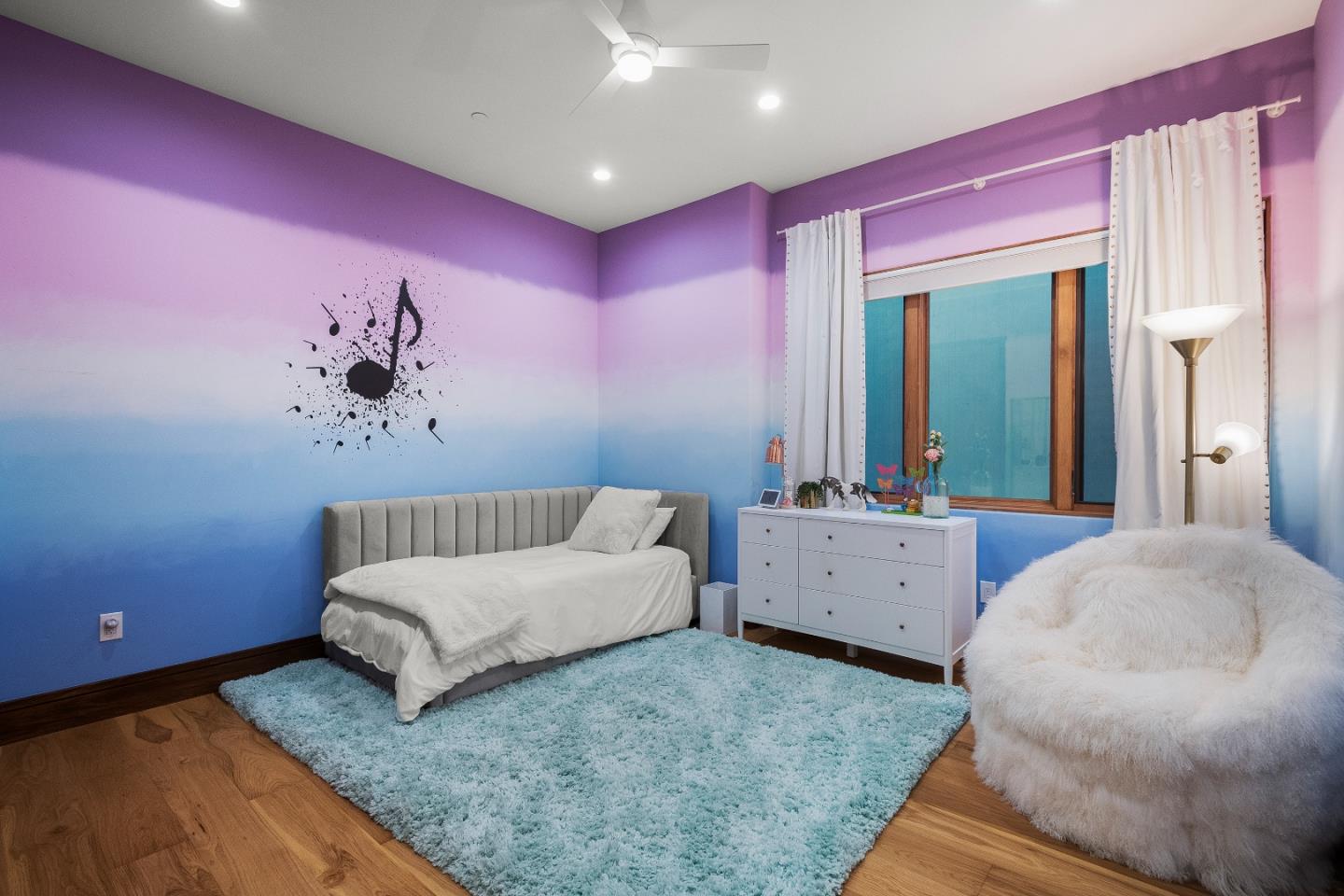 16362 Hilow Road Los Gatos, CA 95032 - Photo 38 of 55 a spacious bedroom with a bed and a table