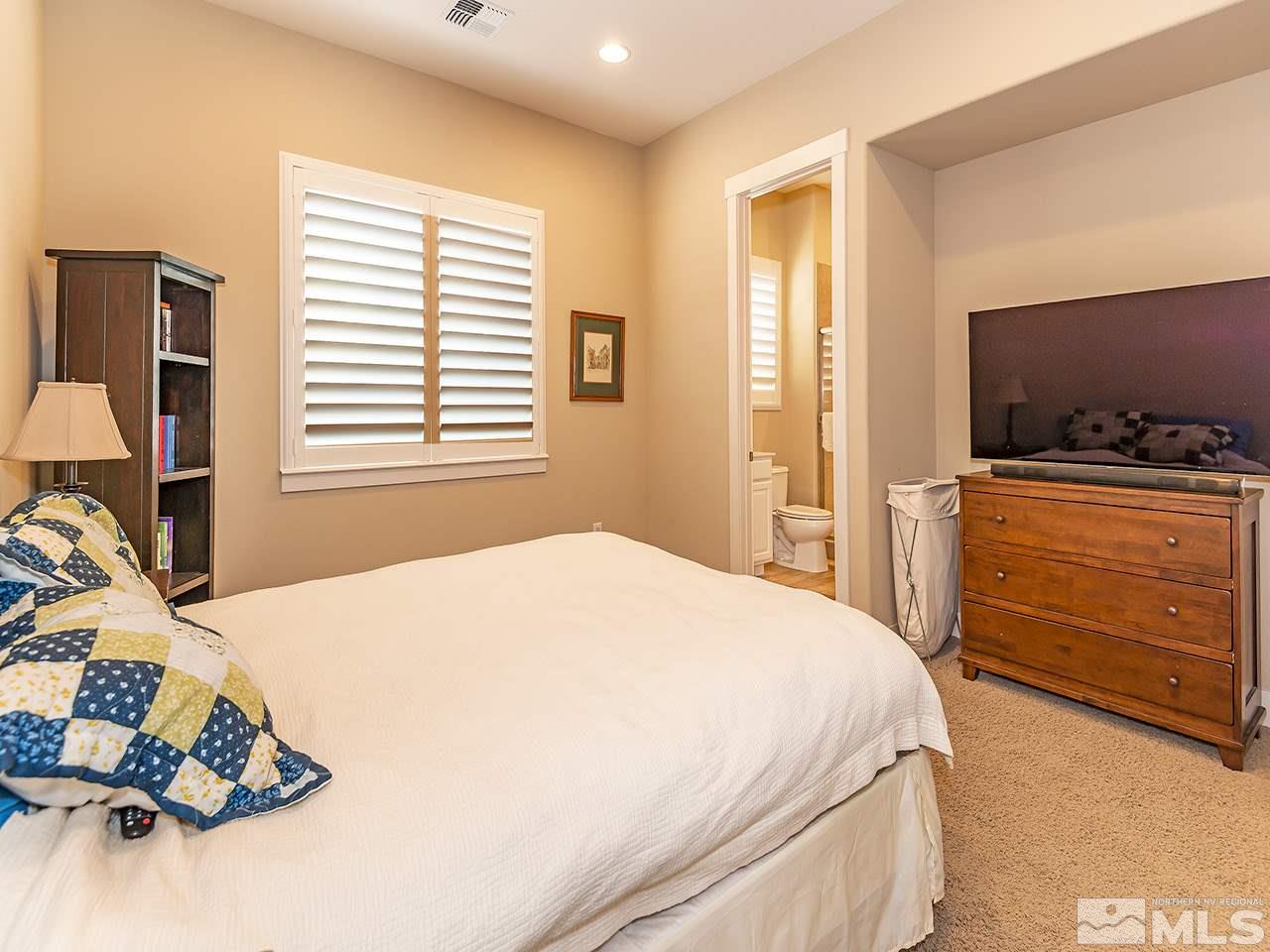 2940 Ethelinda Way Reno, NV 89521 - Photo 16 of 19 a bedroom with a bed and a flat screen tv