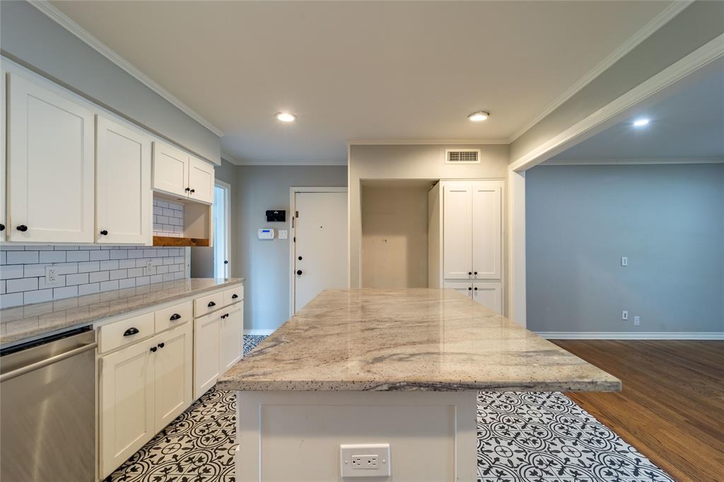 9823 Mercer Drive Dallas, TX 75228 - Photo 9 of 40 Center island with large breakfast bar