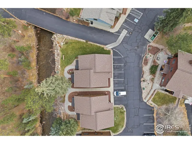 an aerial view of a house with swimming pool and outdoor space